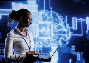 Professionnelle utilisant un laptop avec un affichage futuriste d'intelligence artificielle en arrière-plan, symbolisant l'intégration de l'IA dans les processus métiers.